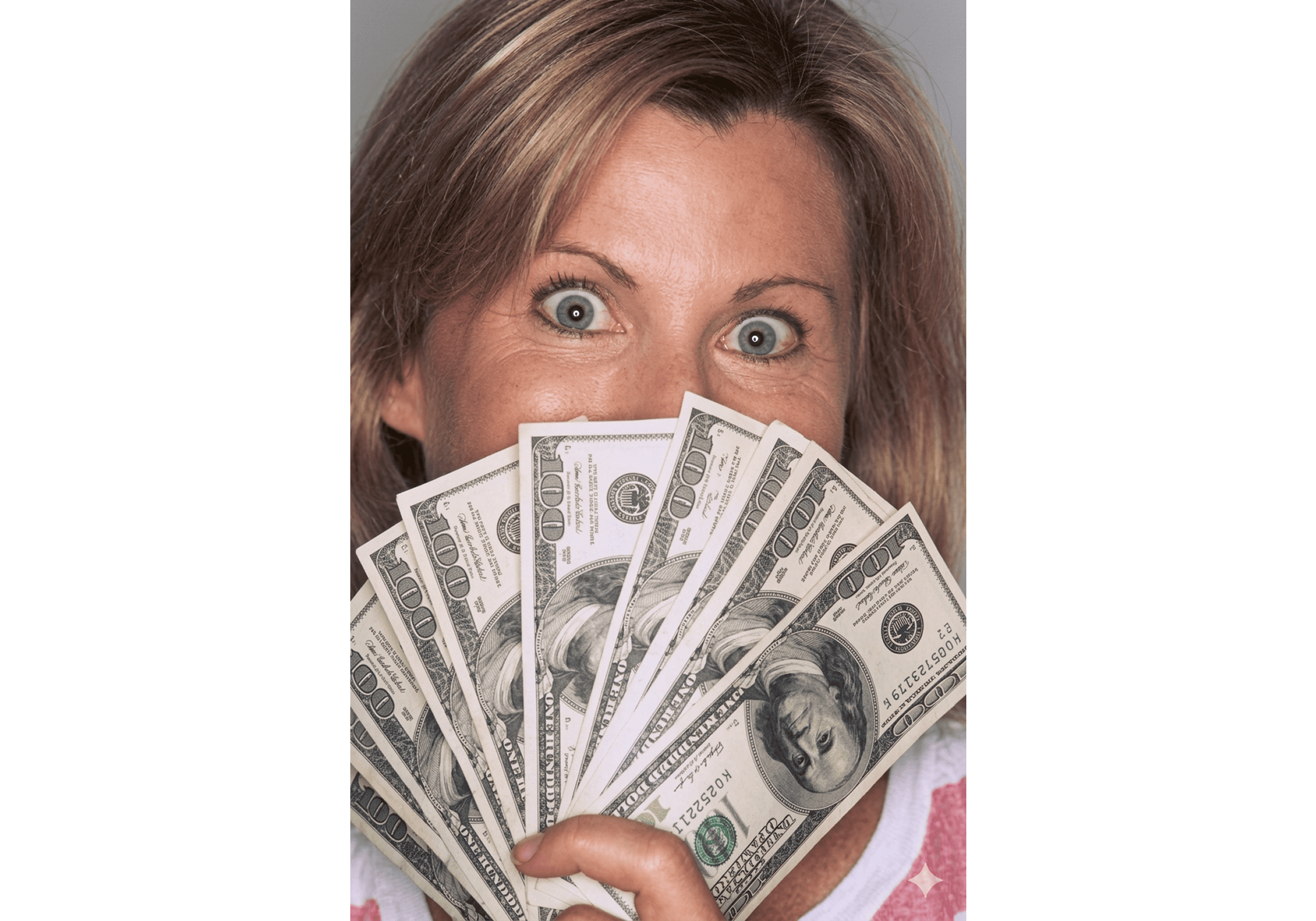 Woman holding multiple dollar bills